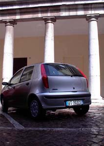 A modern car sits in front
of ancient columns