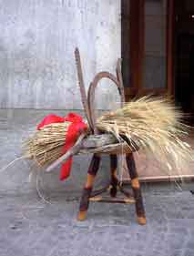 Old fashioned sheaf of wheat on a brightly colored stool