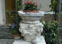 Now used to hold a flower pot, this large stone bowl was 
originally created in the 1500s and later abandoned.  Mensa 
found it near Cagli and restored it.
