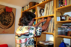 Giaconni searches through record collection