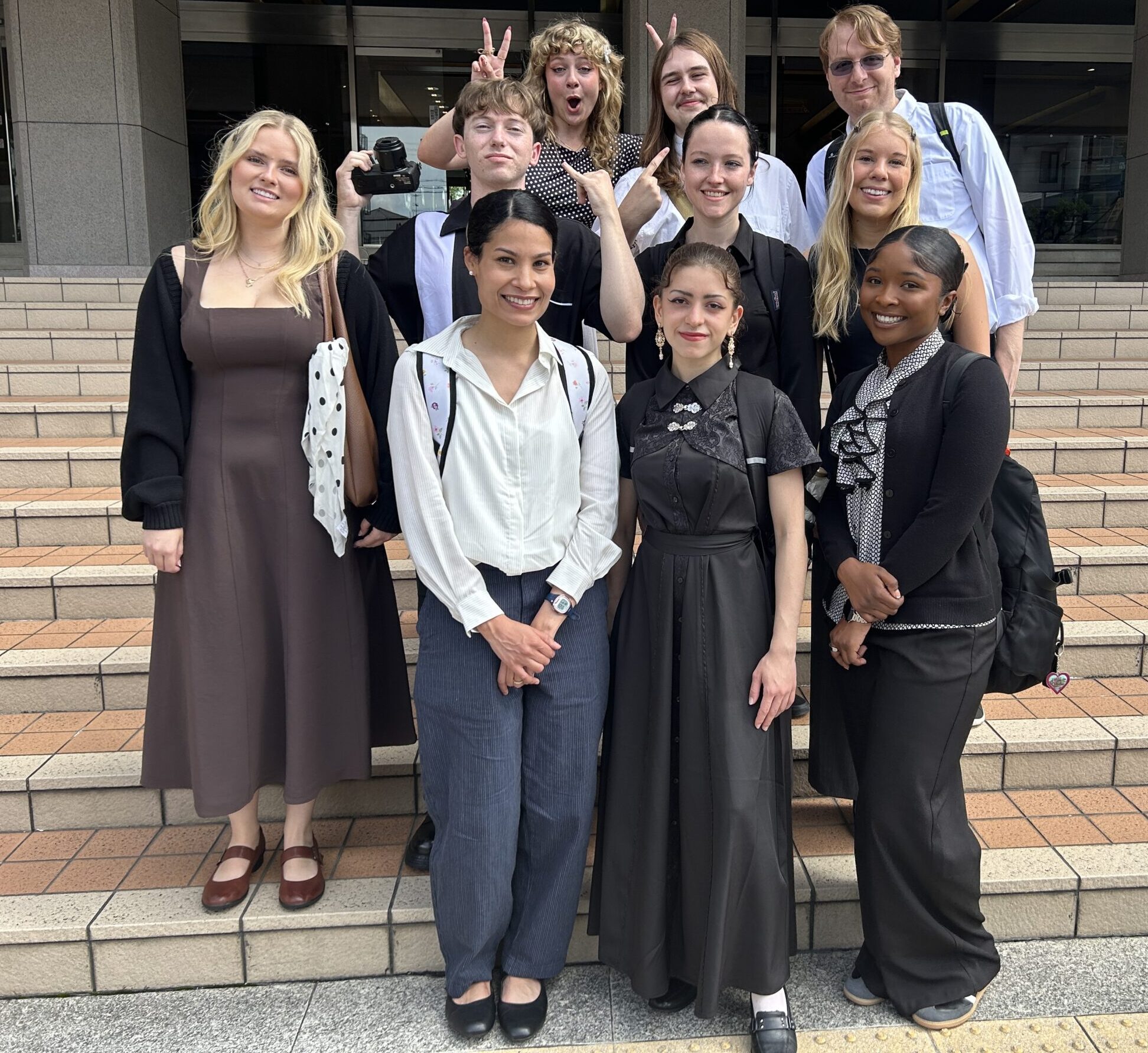10 students stand on steps of Kyoto University of Foreign Studies